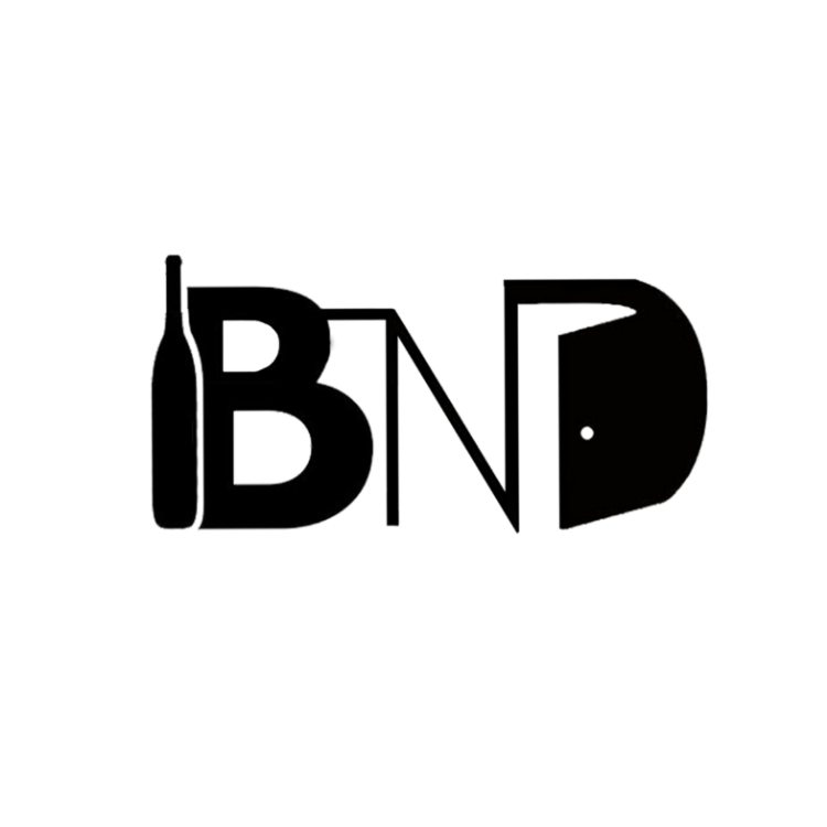 The Bottle Next Door" logo, consisting of the initials "BND" in bold, modern typography, with a black and white color scheme. The letters "B" and "D" are connected with a horizontal line, resembling a bottle cap.