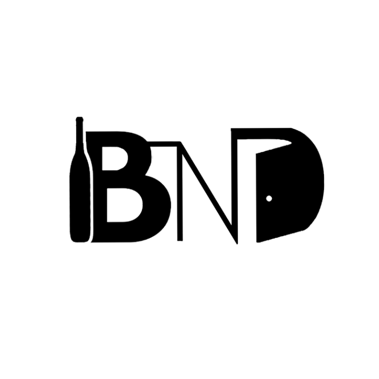 The Bottle Next Door" logo, consisting of the initials "BND" in bold, modern typography, with a black and white color scheme. The letters "B" and "D" are connected with a horizontal line, resembling a bottle cap.